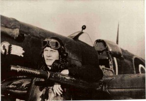 Flt Lt John Harder relaxing against the wing of his Spitfire "L for Lechery"
